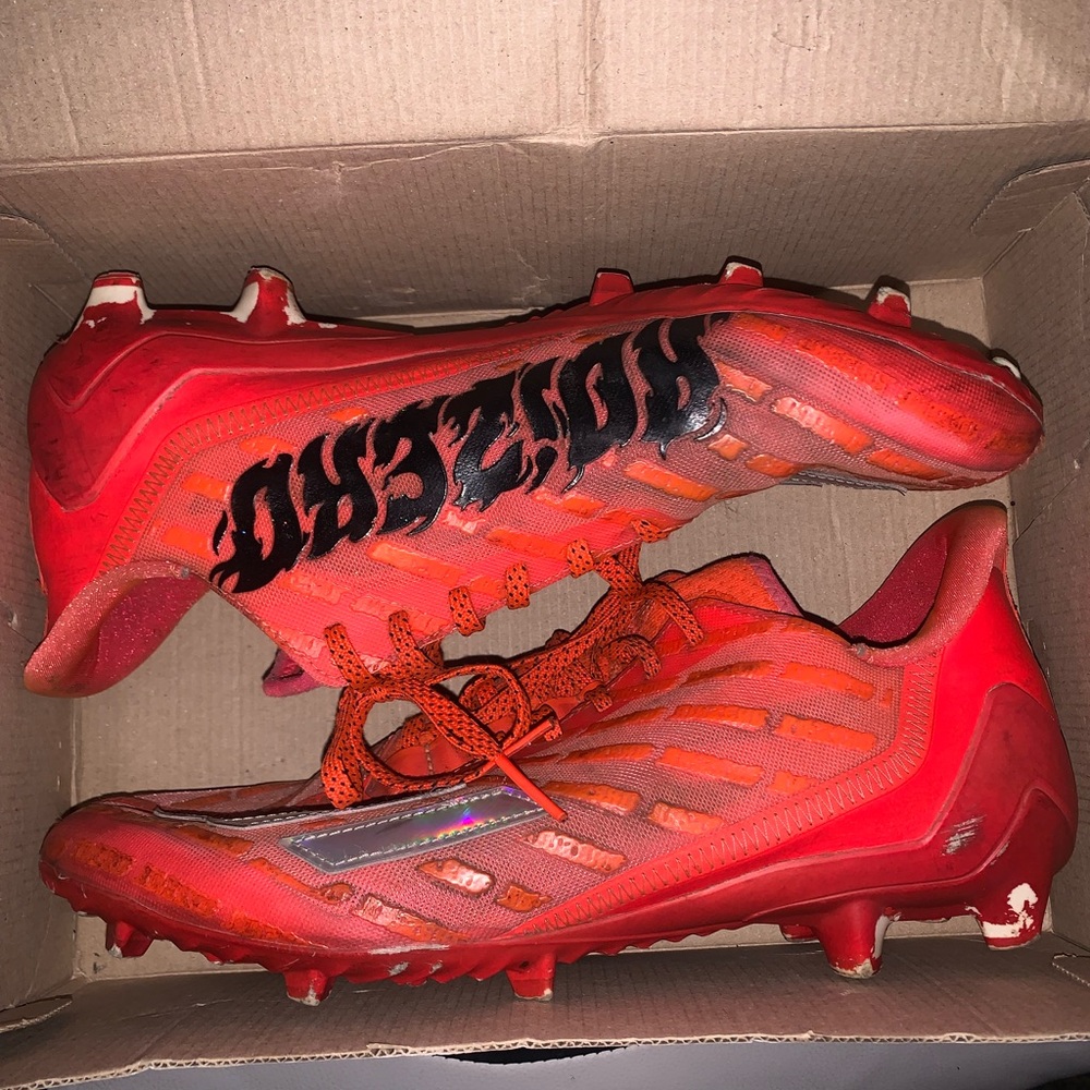 Orange and red adidas cleats